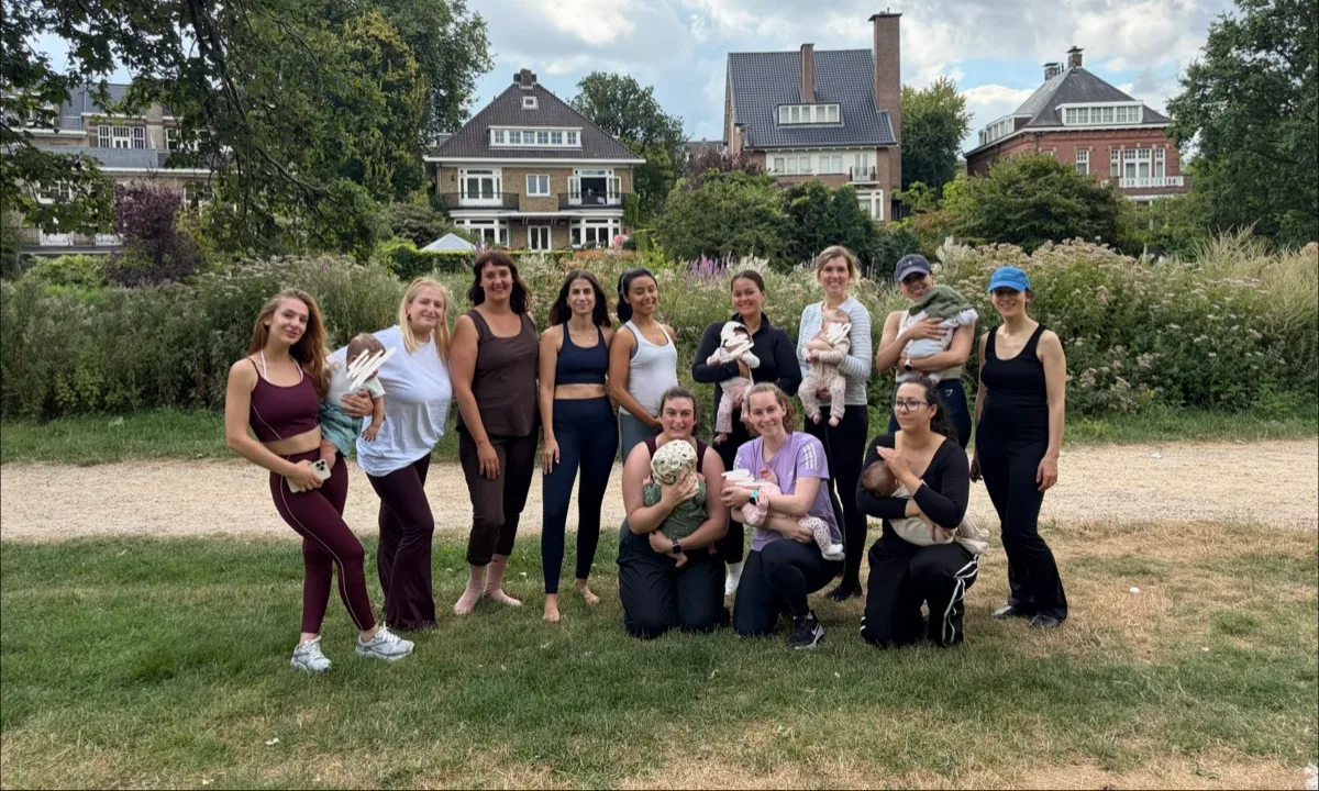 Moms and babies together after a gentle yoga session in Vondelpark