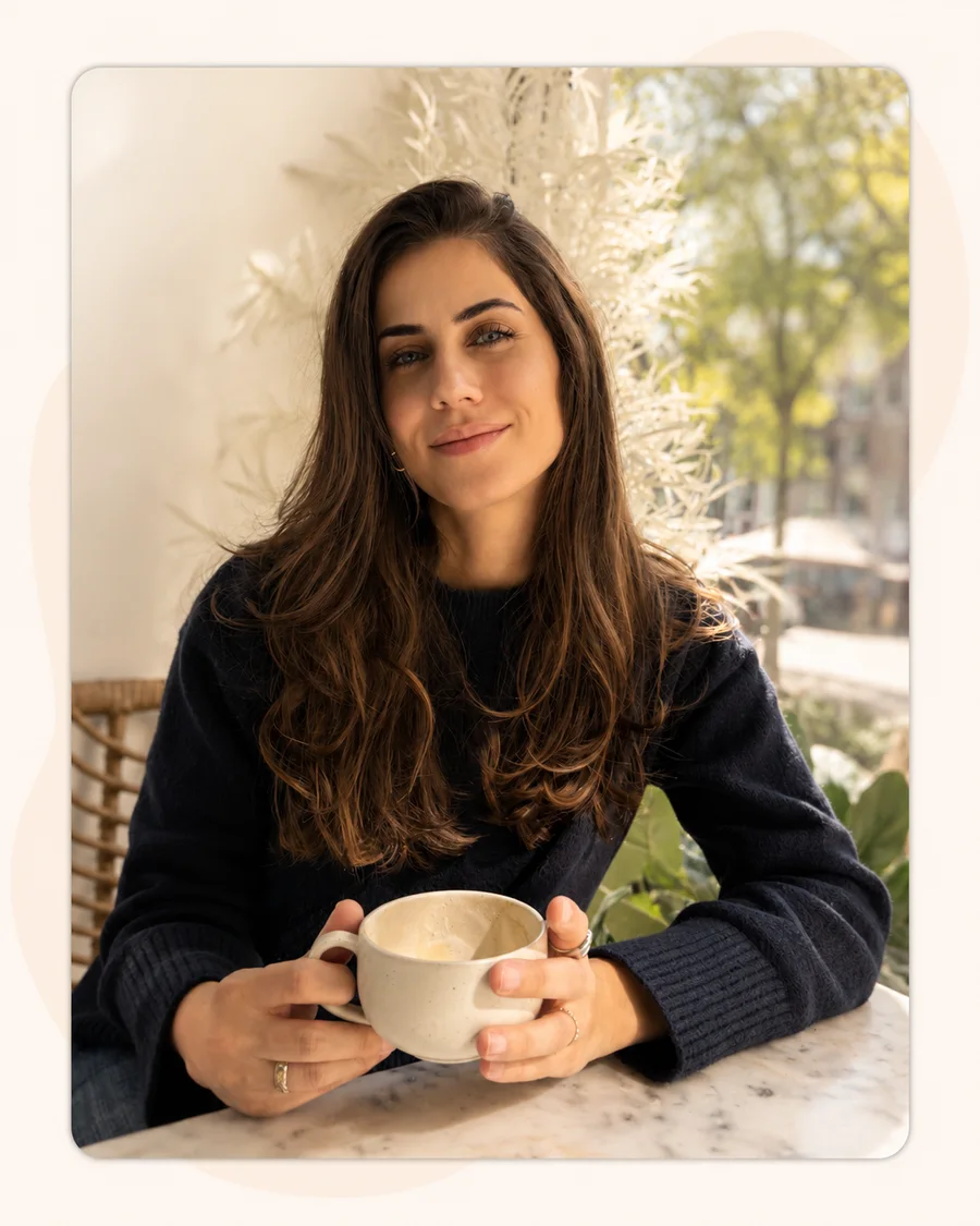 Burcu, founder of Mama Circle, enjoying coffee in Amsterdam